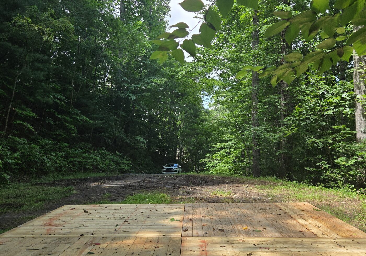 Looking out from the deck at Nantahala 10, Cardinal Mountain Campground, toward the parking area