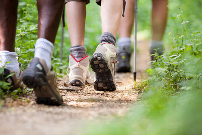 Hikers on a wooded mountain trail in the Nantahala National Forest near Franklin, North Carolina